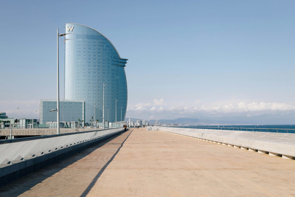 A view of the Barceloneta neighborhood of Barcelona, with its modern waterfront and international hotels. Photo by Yelena Odintsova for pexels.