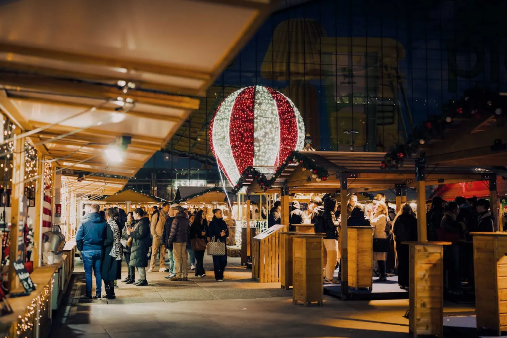 The Christmas Market, Noel de la Defense in Paris, is popular with locals for evening shopping and socializing. Photo c. Paris Touris by Debajit Kiran Paul Landscape