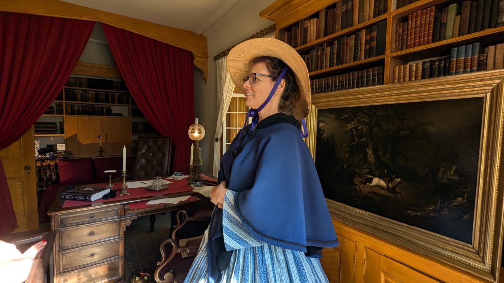 Guide at Sunnyside gives tour of Washington Irving's writing desk.