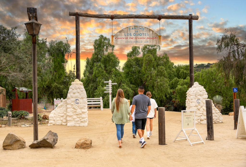 Family walks into Leo Carillo State Park in Carlsbad, CA. Photo c. VisitCarlsbad