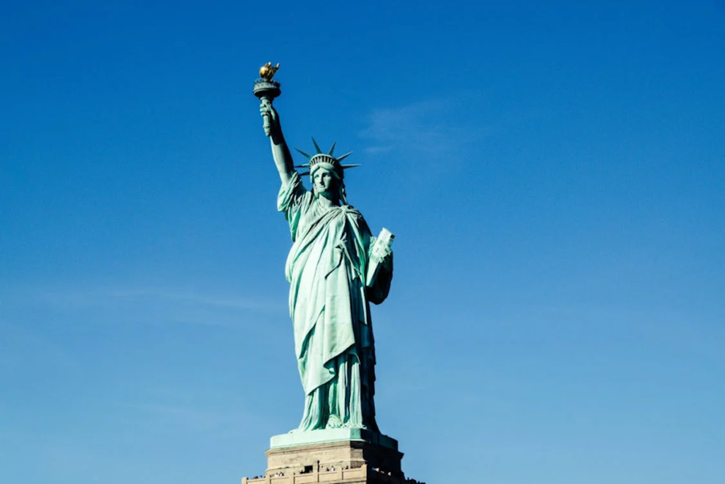 Learn about freedom through travel to the Statue of Liberty in New York harbor. Photo c. pexels.