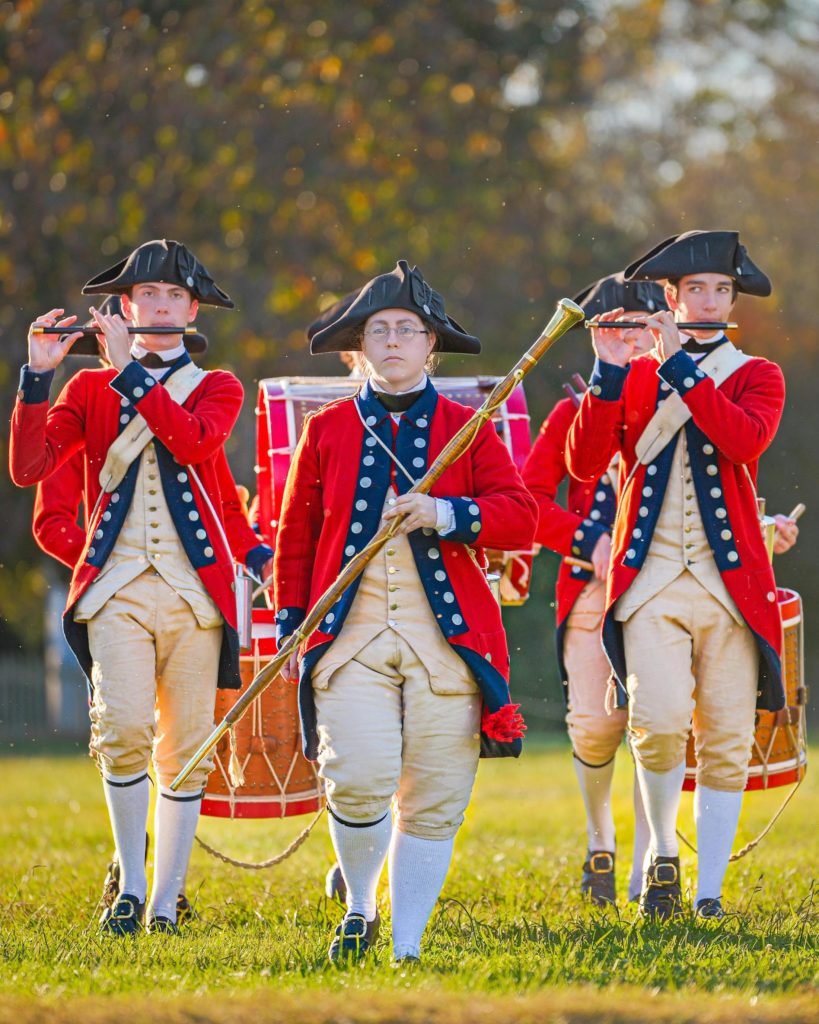 Learn about colonial times by watching American soldiers parade at Colonial Williamsburg. Photo c. vividvoyage for pexels.