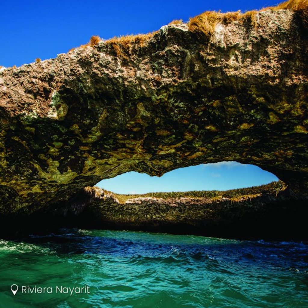 An eye cut into the rock provides access to Hidden Beach, a top adventure destination along the Riviera Nayarit. Photo c. Riviera Nayarit Tourism.