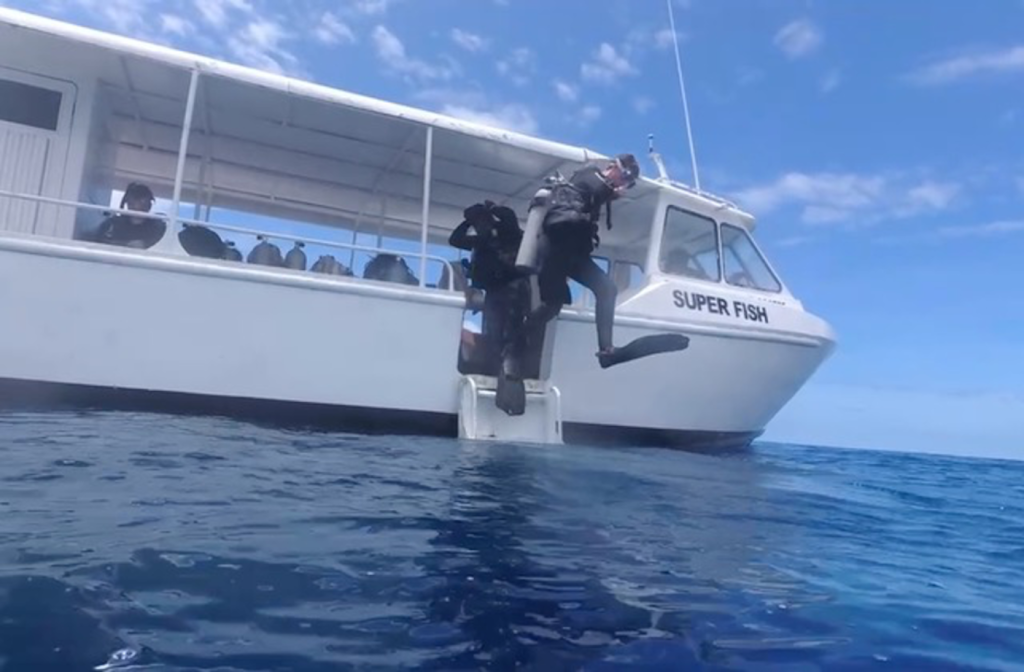 This is what we love about traveling with teens - they're always jumping in for another adventure. We are diving in Somosomo Strait, Fiji. Photo c. Ashley Spencer