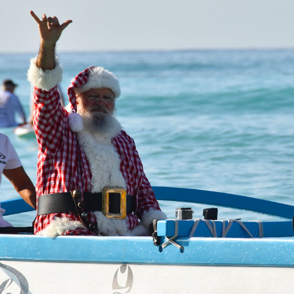 hawaiian santa in canoe