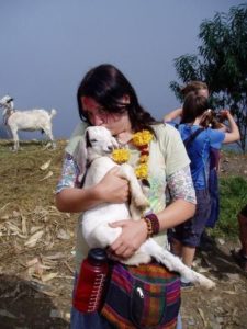 Author Cradles Goat in Nepal