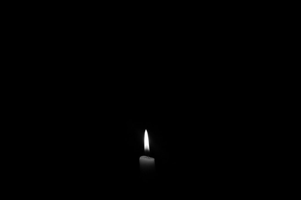 A black candle is lit