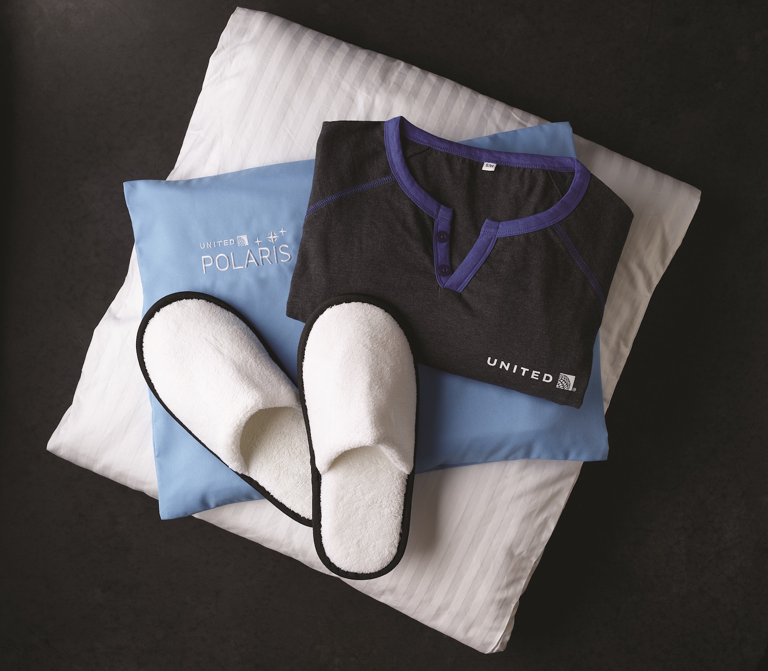 Pillows, slippers and cozy bedding when you fly United business class to Sydney