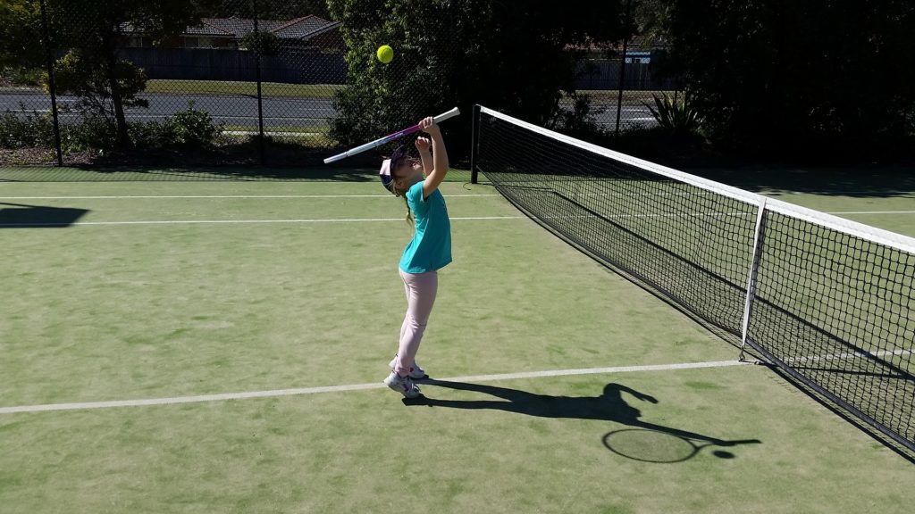 tennis playing boy
