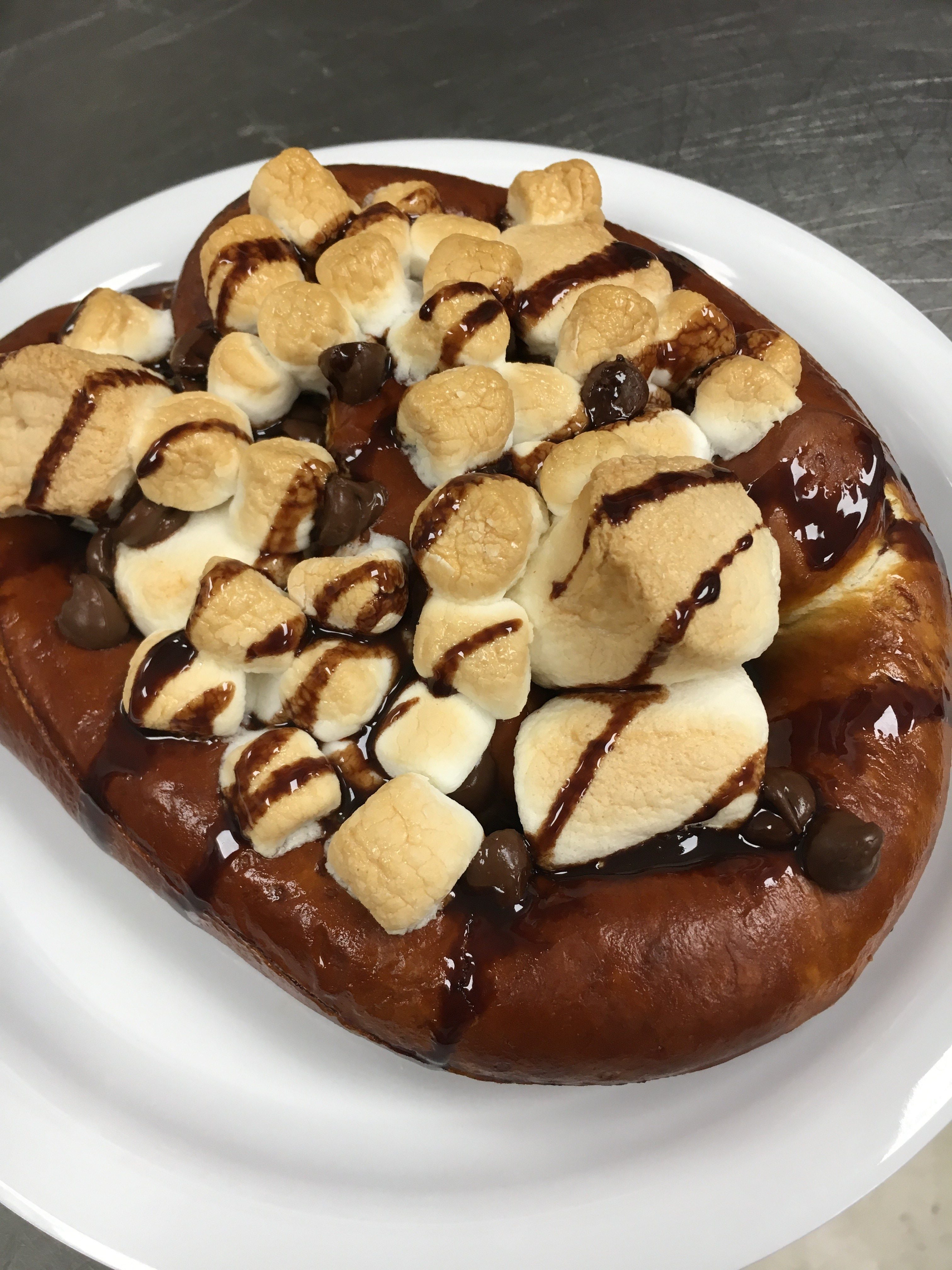 pretzel topped with marshmallow and chocolate