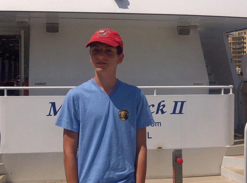 Devin poses in front of sightseeing lunch cruise.