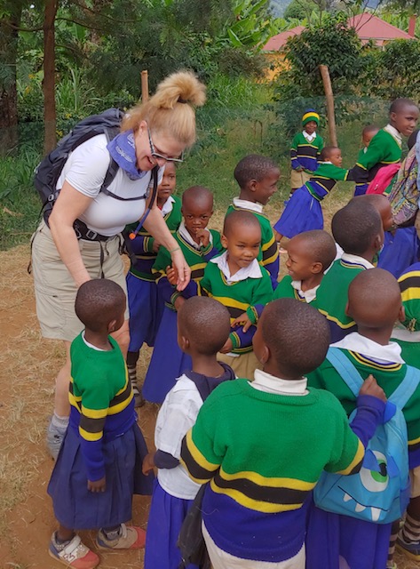 Author visits with school children in Tanzania.