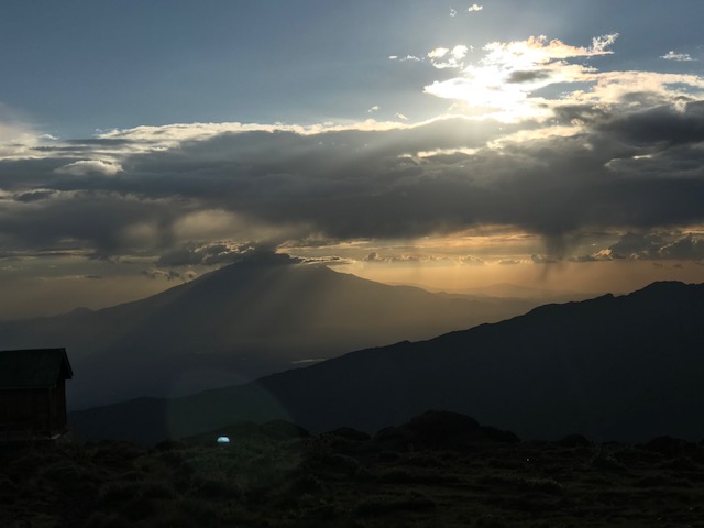 Sunset over the peaks of Africa seen from Mount Kilimanjaro.