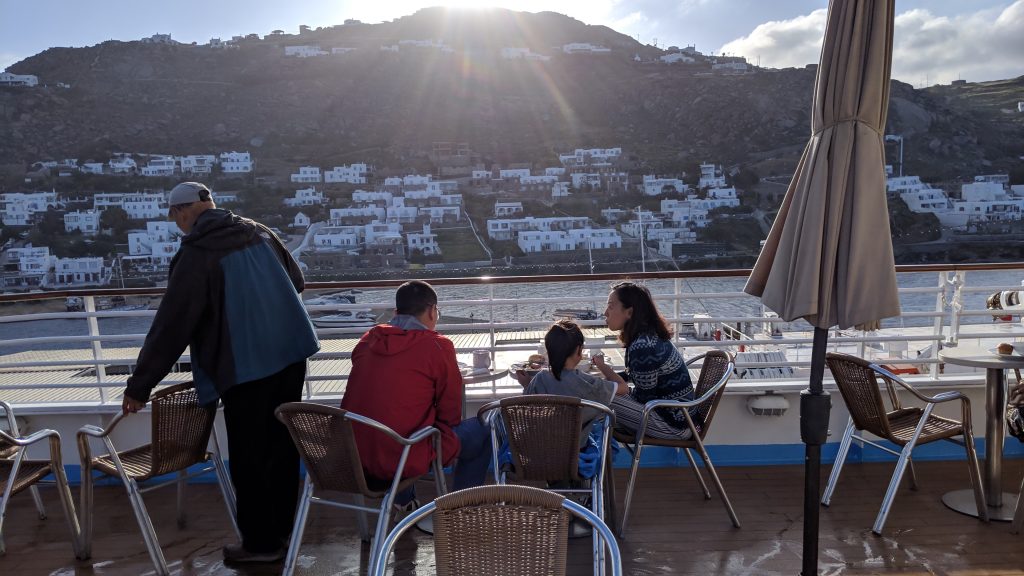 Having breakfast on the deck of the Celestyal Crystal off the coast of Mykonos.
