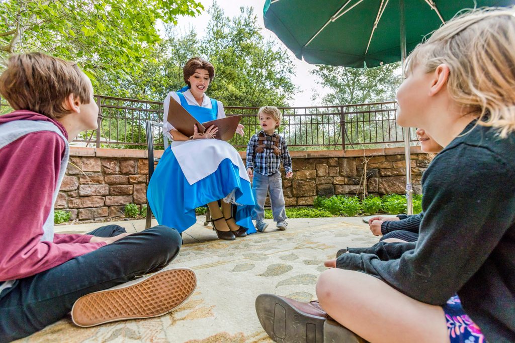 Snow White reads to children at Disneyland Resort character breakfast