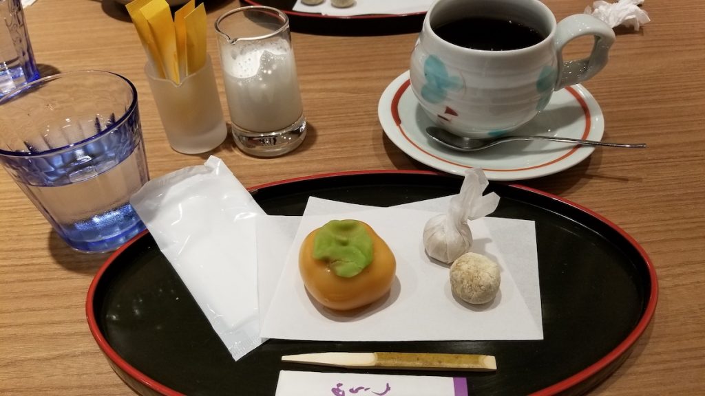 Persimmon shaped confection with biscuits at Japanese coffee shop.