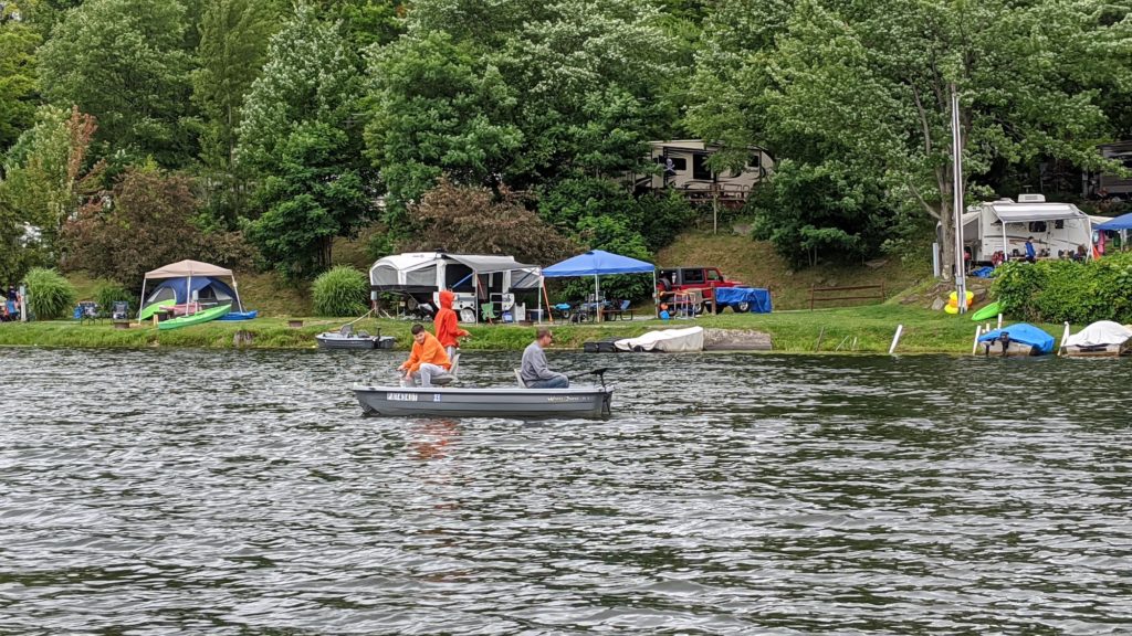 tents and RVs along a lake shoreline.
