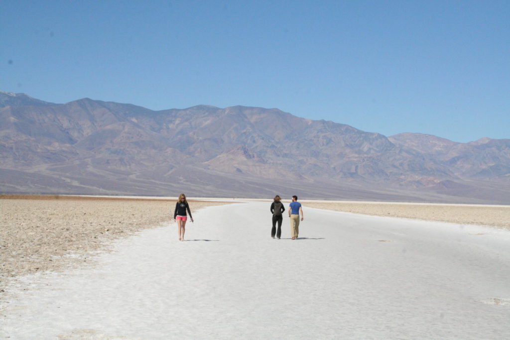 Hikers walking the Badwater Trail in Death Valley National Park.