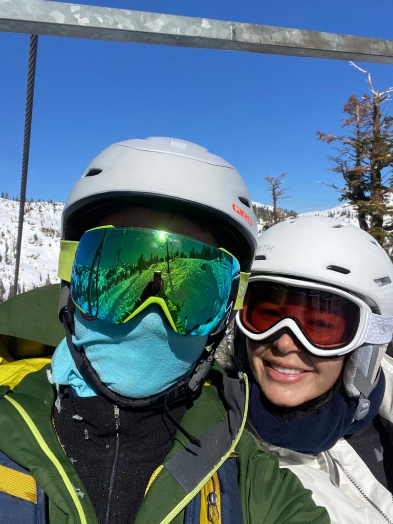 Couple in goggles on chairlift at Squaw Valley in Lake Tahoe.