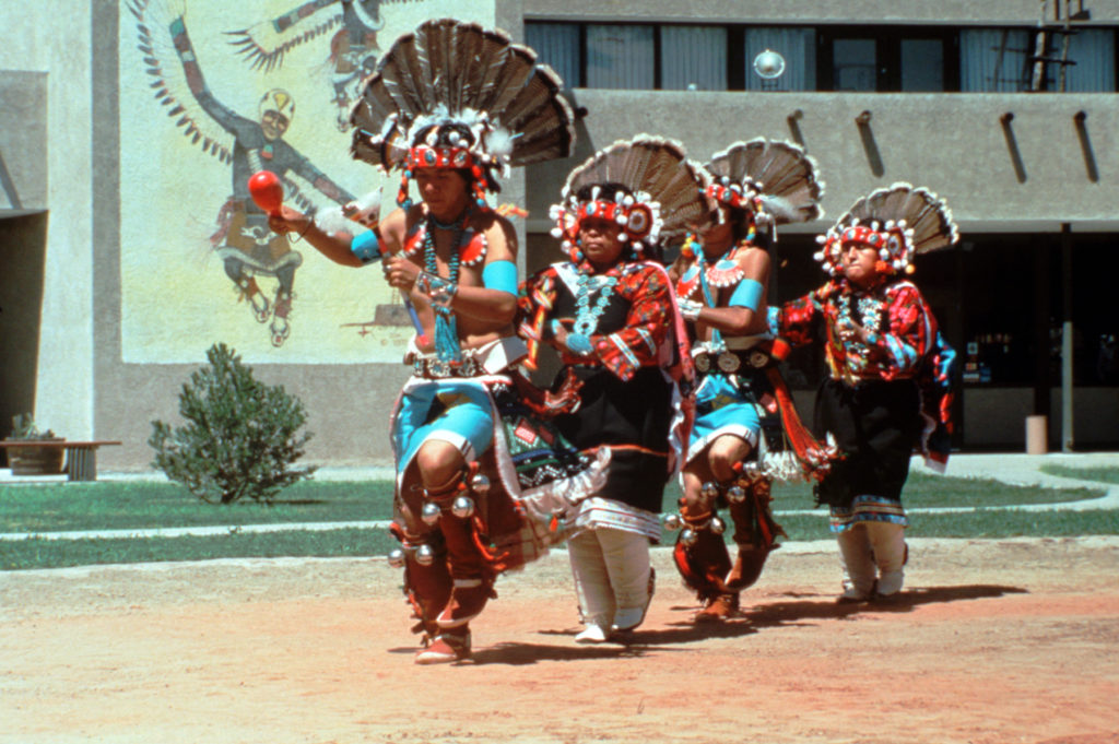 Costumed Native American dancers perform outside the Indian Pueblo Cultural Center in Albuqerque. Photo by Ron Behrmann for Visit Albuquerque.