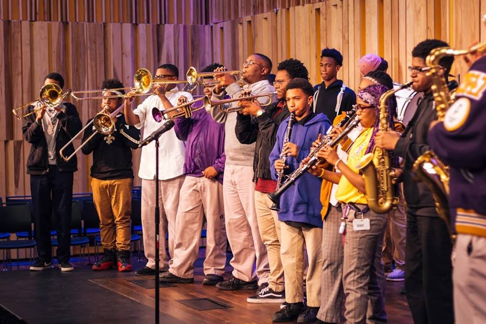 Students from Trombone Shorty Academy practice brass instruments at New Orleans Jazz Museum.
