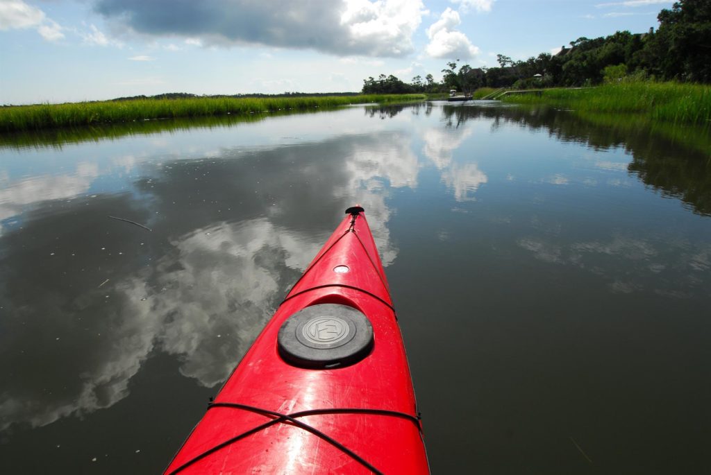 Red kayak bow in the marshlands of North Carolina. Photo c. BaldHeadIsland.com