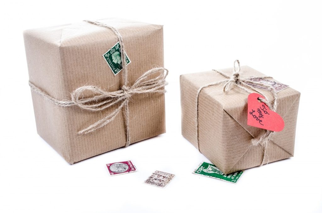 Gifts in brown paper boxes with string ribbons.