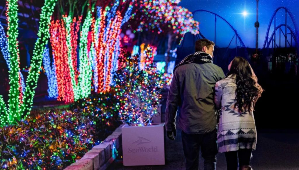 Couple walking by illuminated street in Orlando, Florida.