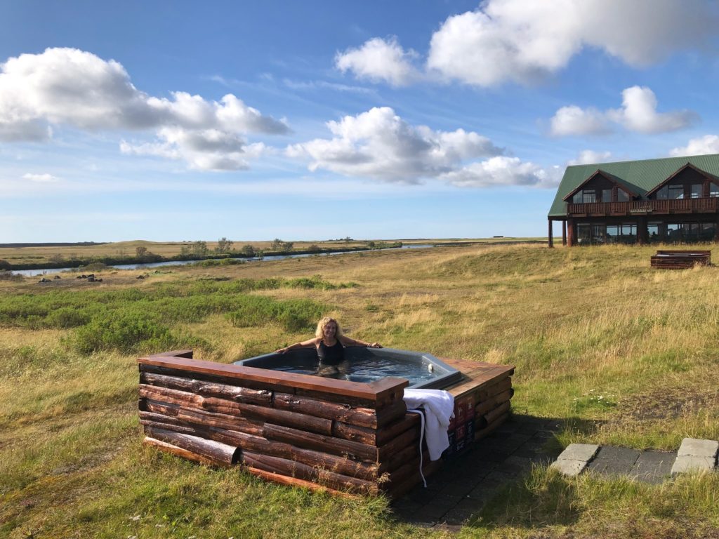 Author enjoying a geothermal hot tub outside the Hotel Ranga in southern Iceland. Photo by Bethany Kandel.