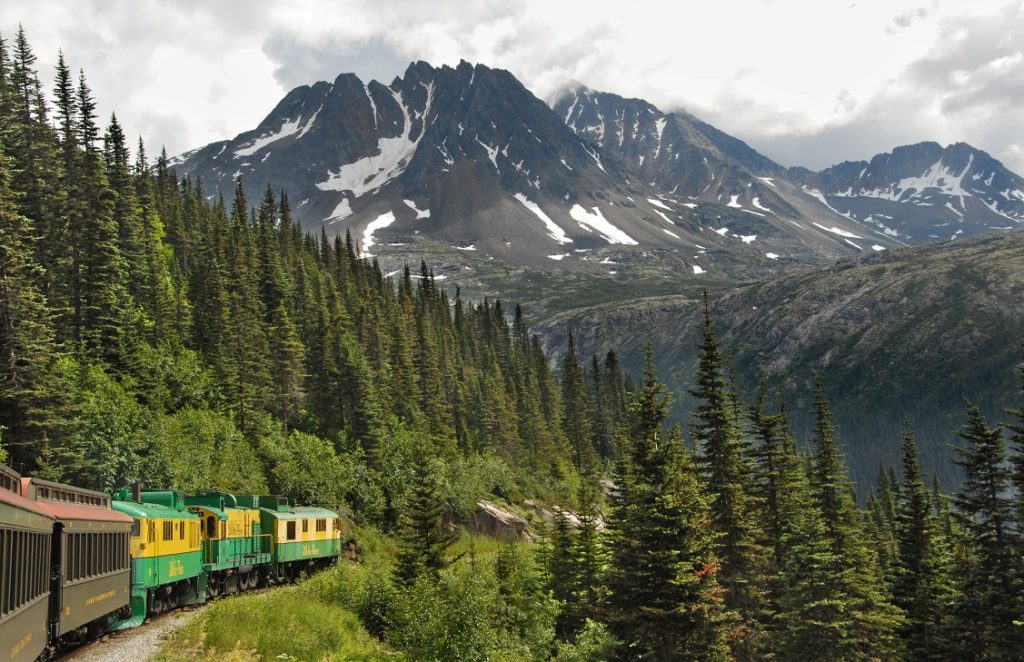 White Pass & Yukon narrow guage railway circles a mountain in Alaska. Photo c. Holland America Line