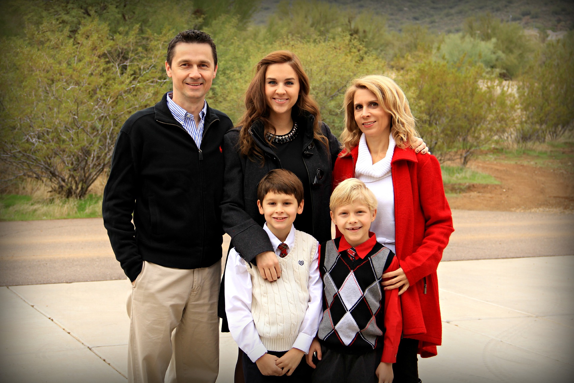 Parents and children in a step or blended family smile at camera.