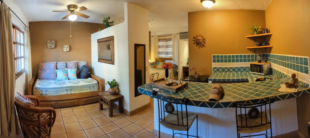 One bedroom with kitchen and sofabed accommodates families at Los Bungalows, a small boutique hotel in the hills above Cabo San Lucas.