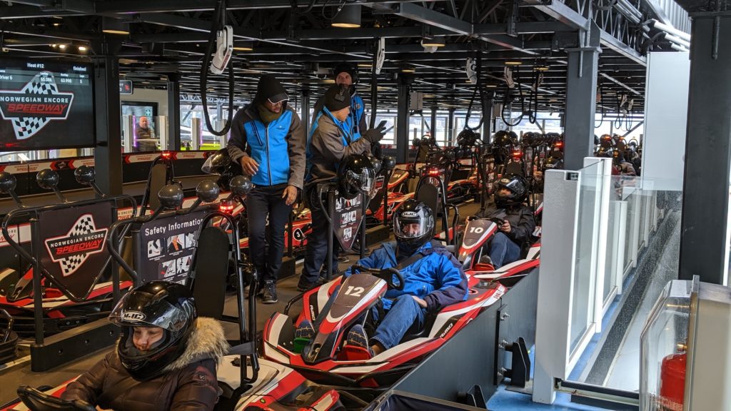 All ages strap in for a race at Speedway, a go-kart track on the Norwegian Encore. Photo c. Kyle McCarthy/FamilyTravelForum