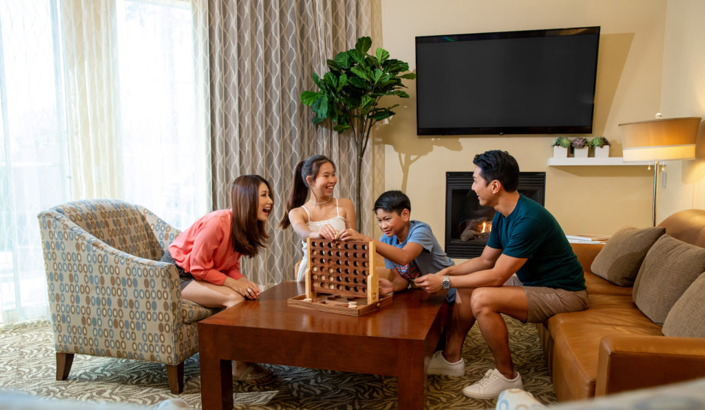 Family game time around the hotel room during spring break vacation at Hyatt Regency Indian Wells Resort in California. Photo c. Hyatt Regency.