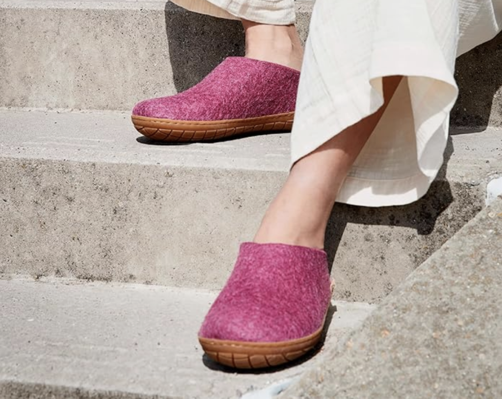 Cranberry colored Gerups felt slippers with rubber soles are caught out on a walk through a Greek village. Photo c. Amazon.com