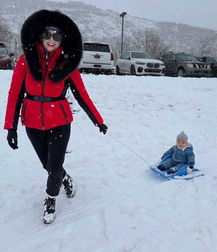 Mom and infant go out for a sleigh ride in Park City, Utah. Photo c. Laura Sutherland