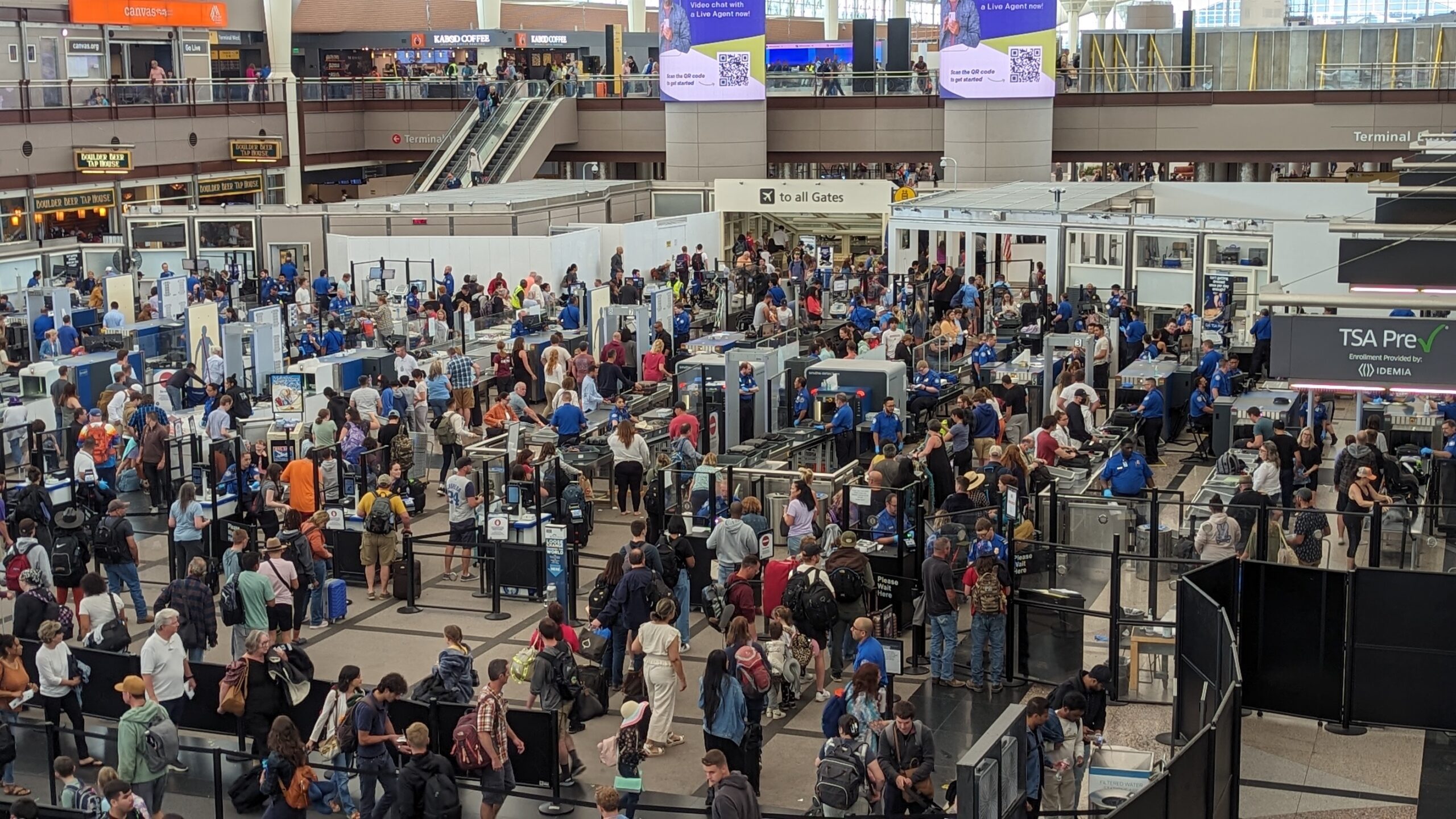 Aerial view of long security lines at Jeppesen Terminal at Denver International Airport.