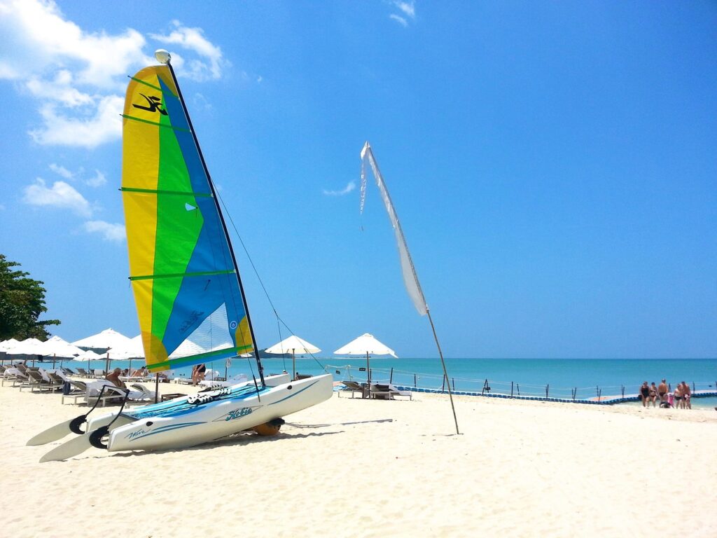 A sailboat awaits tourists outside a Phuket family resort.  Photo c. Phontip Ward for pixabay.