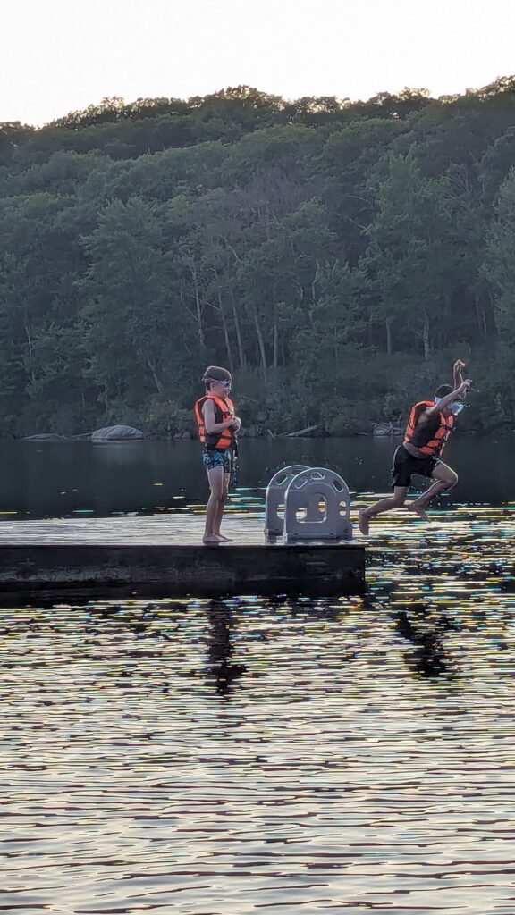 Kids jumping in to Breakneck Lake in Harriman State Park.