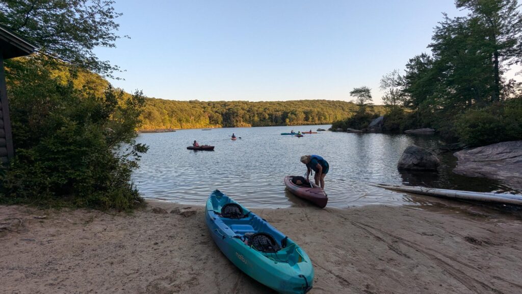 Kayak along the shoreline at dusk.