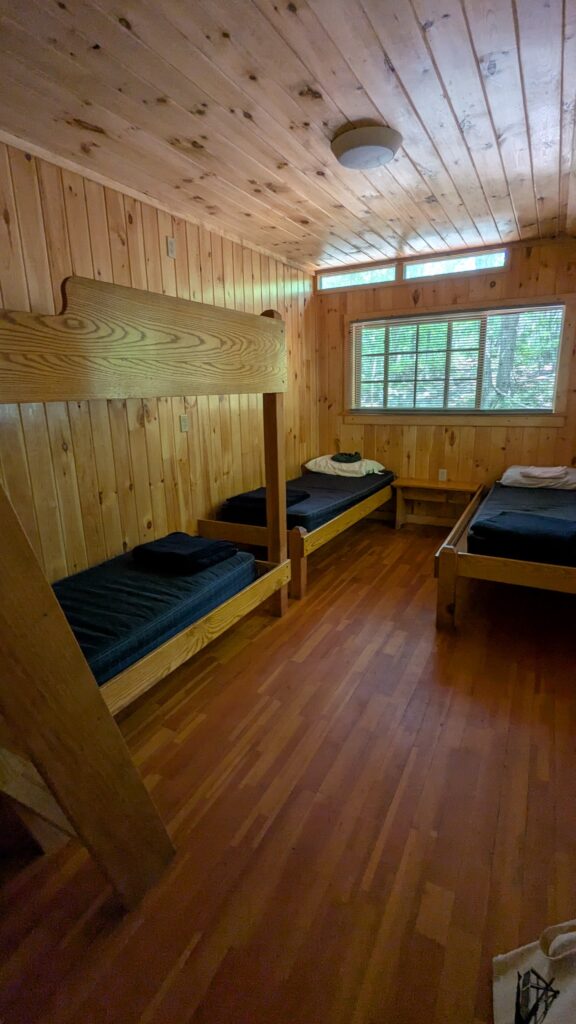 Bunk houses with a dozen bunk beds, shared bath and dining room are typical of the AMC's budget lodging options. 