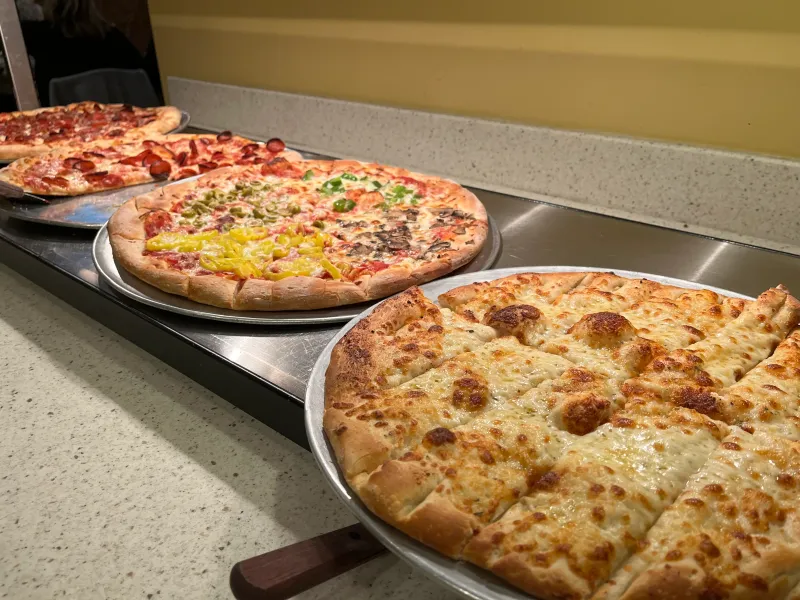 What they serve (and what “all you can eat pizza” really means)