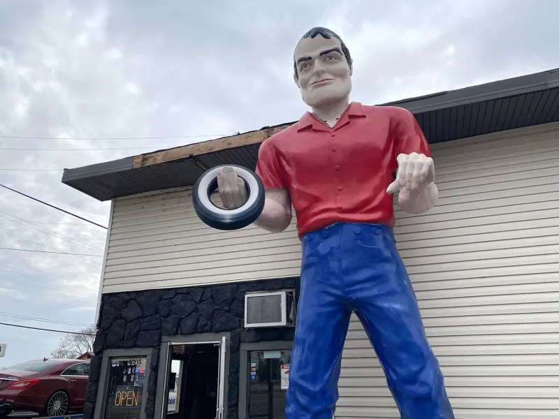 Muffler Man: A Giant Tire-Wielding Sentinel