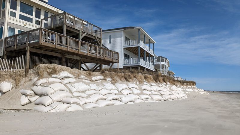 Oak Island: Infrastructure Buckling Under Seasonal Surge