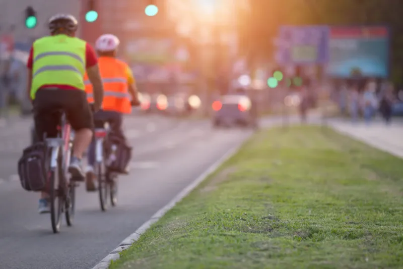 You must keep at least one hand on the handlebars when biking