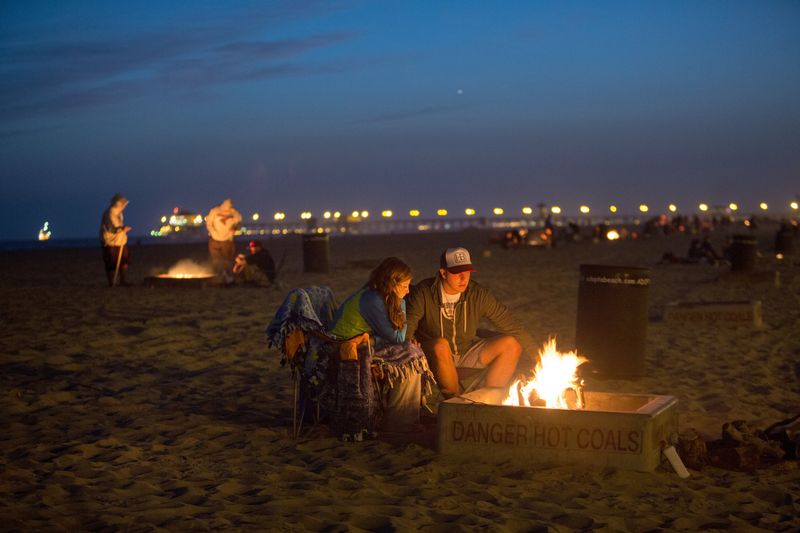 Lighting beach bonfires outside permitted rings
