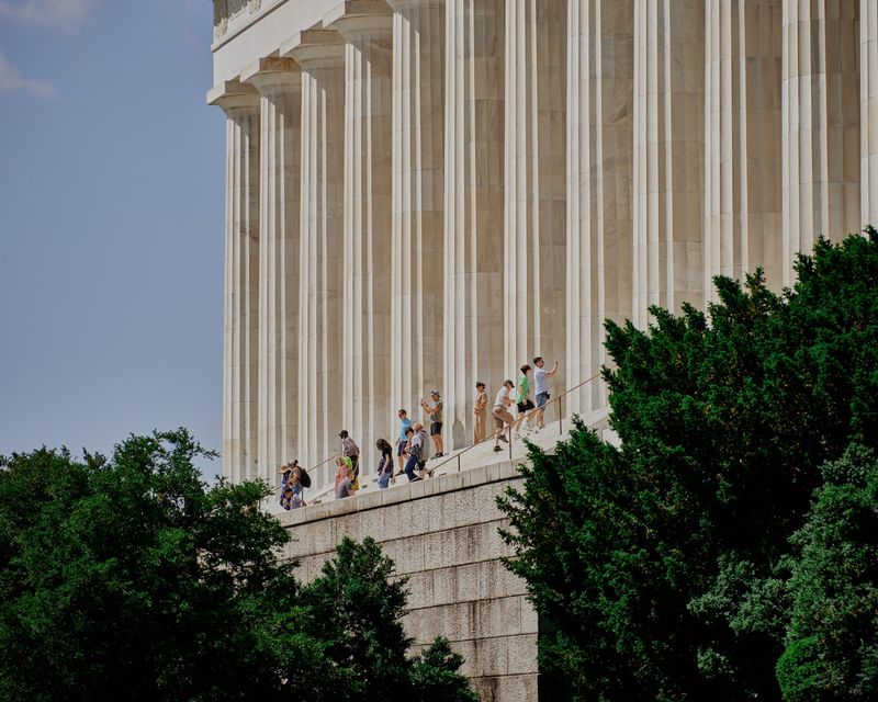 Climbing on the Lincoln Memorial Statue