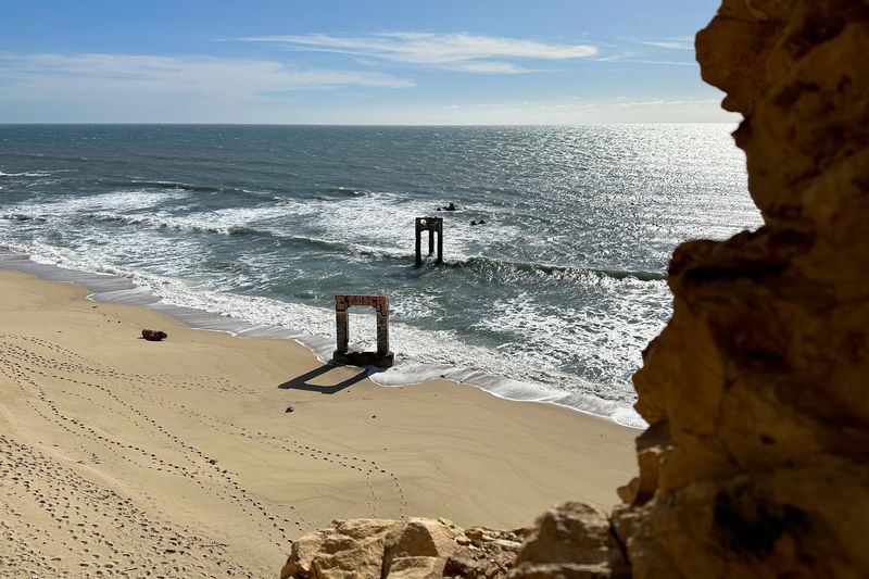 Concrete Pillars Standing Against the Waves