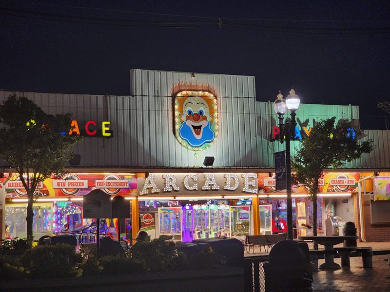 The arcade, humming core of play