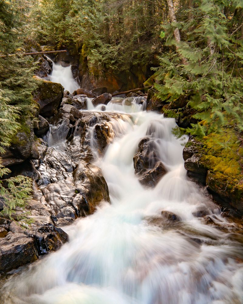 Deception Falls and Its Frozen Cascades Beside the Road